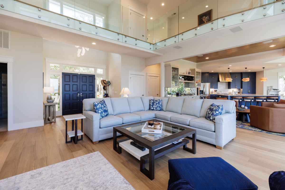 An expansive common room with open loft is presented in this home remodel photo.